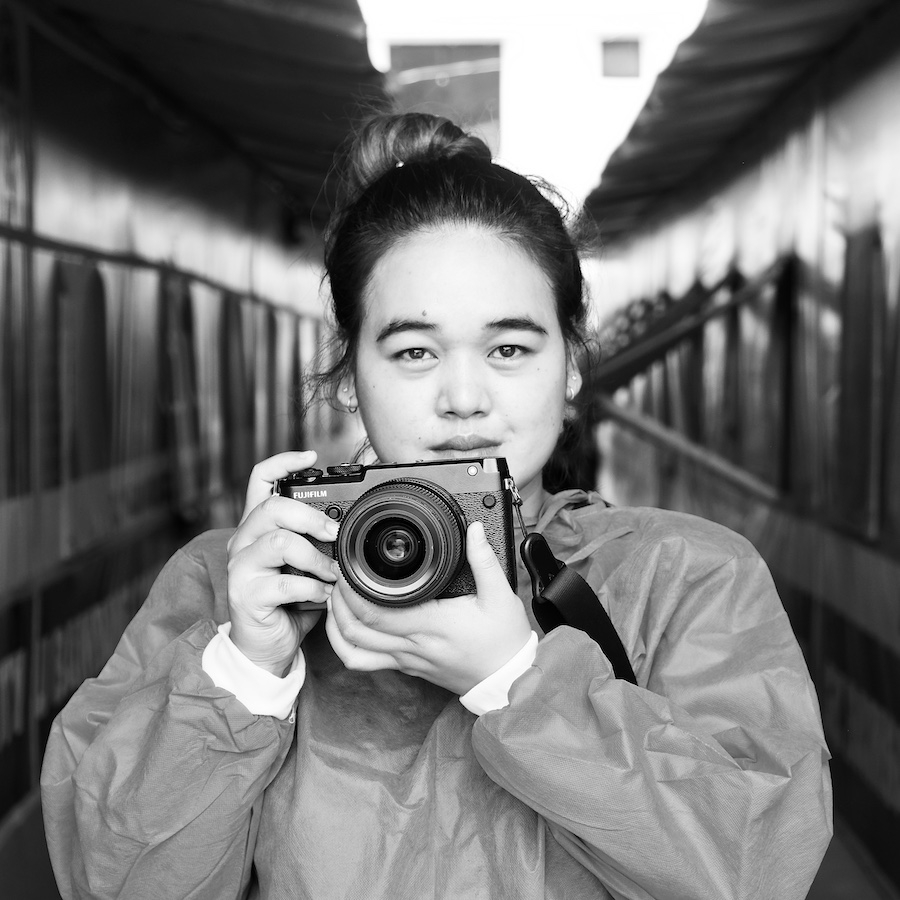 Xyza Cruz Bacani portrait holding camera 